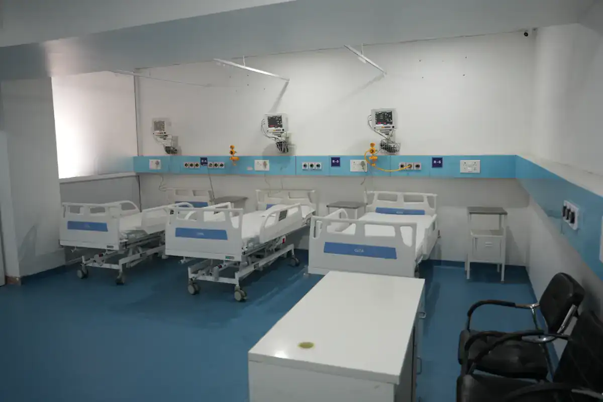 Clean hospital ward with beds and monitors