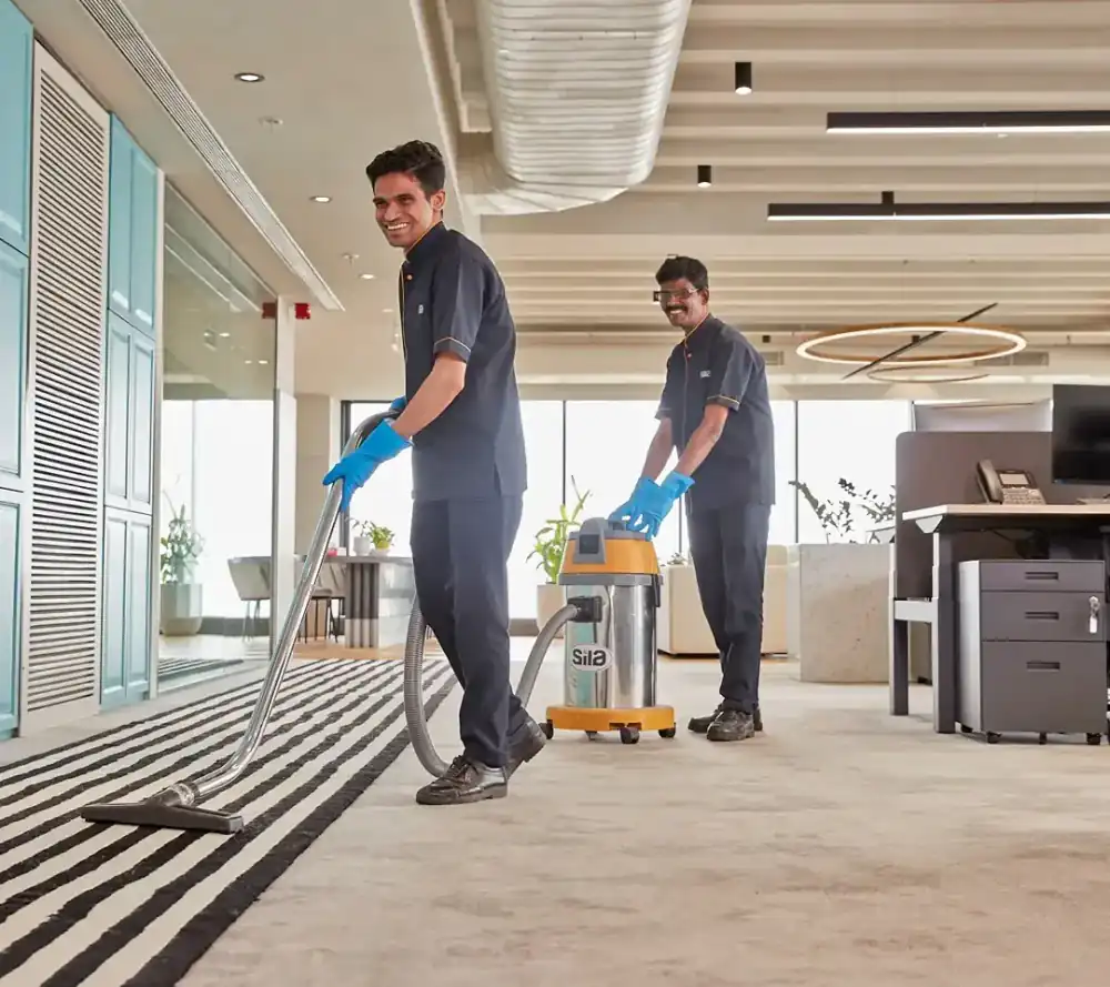 Housekeeping staff cleaning an office