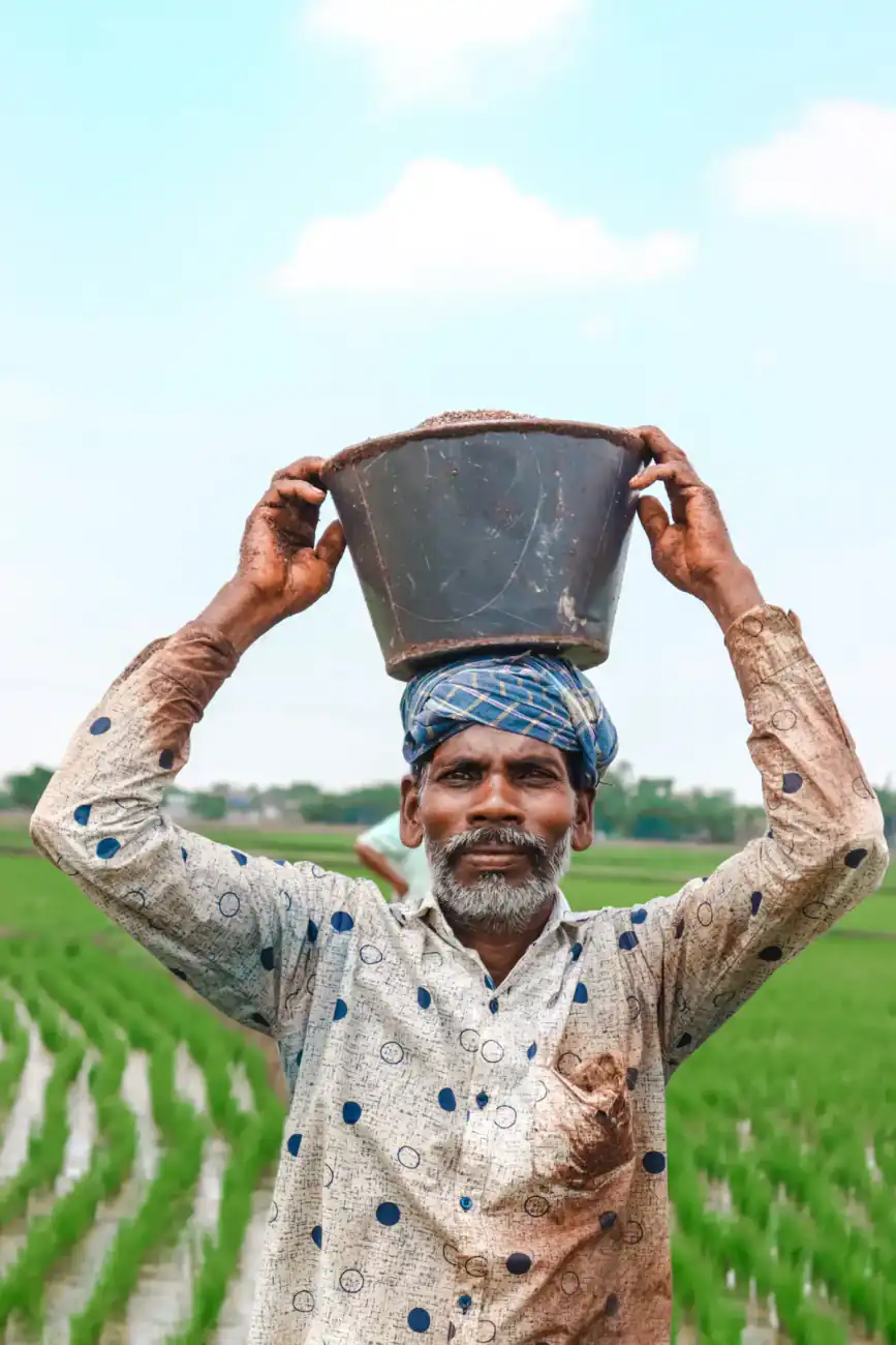 Indian worker carrying a load on his head